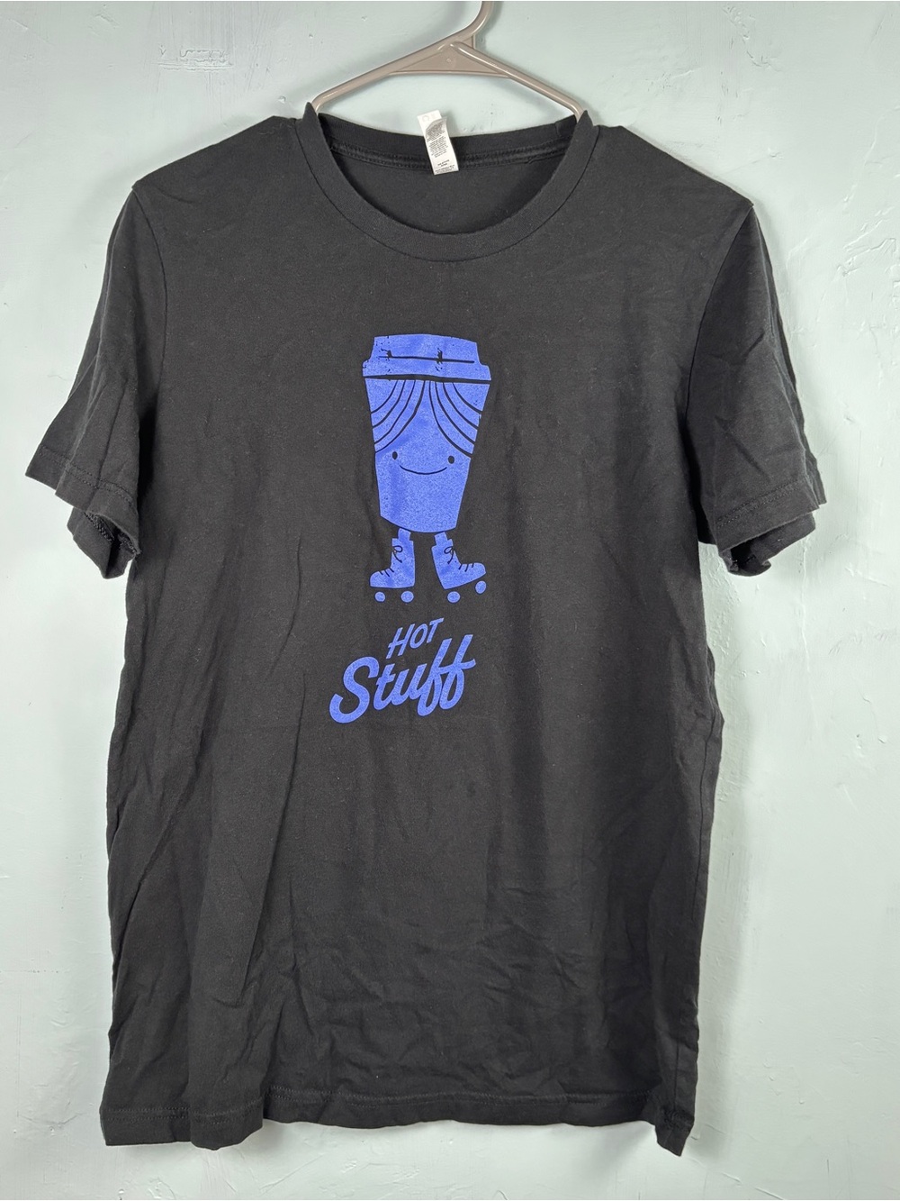 Black 'Hot Stuff' Roller Skating Coffee Cup Tee with Purple Print